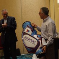 The CEO (left) enjoying the founder's delight at the golf bag that my team designed to commemorate his 50 years commitment to the company.