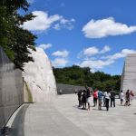 The walls of the memorial bend towards MLK's statue to show that the people bend towards justice.