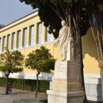 A statue of Evangelis Zappas is located to the left of the Zappeion entrance.